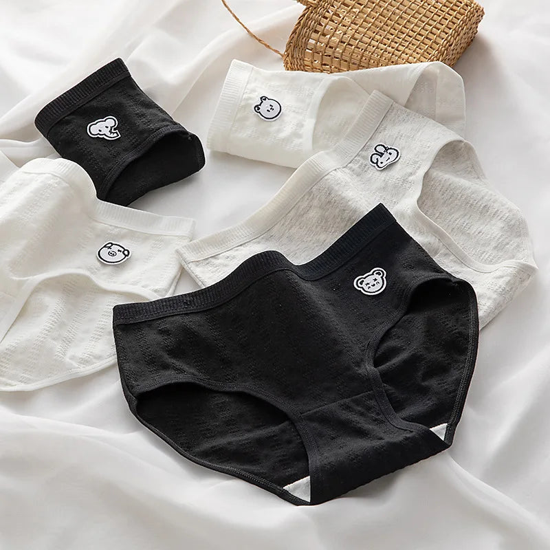 Multi-pack of panties in White, lack, Cartoon Print, featuring various prints. Comfort-fit by Amoura Elegance.