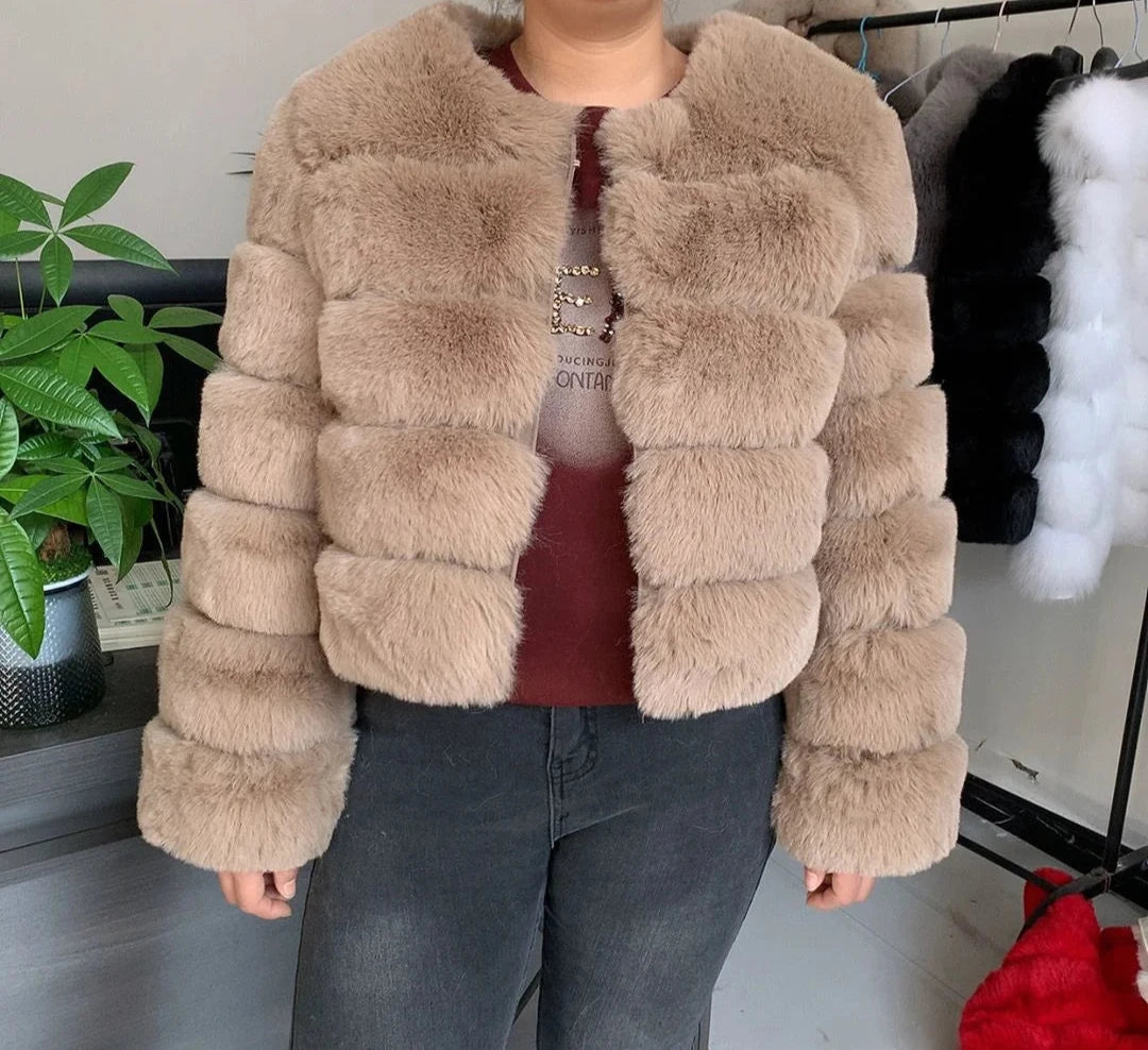 "Amoura Elegance women’s short faux fur coat in stylish khaki, featuring plush faux fox fur, full sleeves, and a cozy 60 cm length, available in size XXXXL for a fashionable fit."