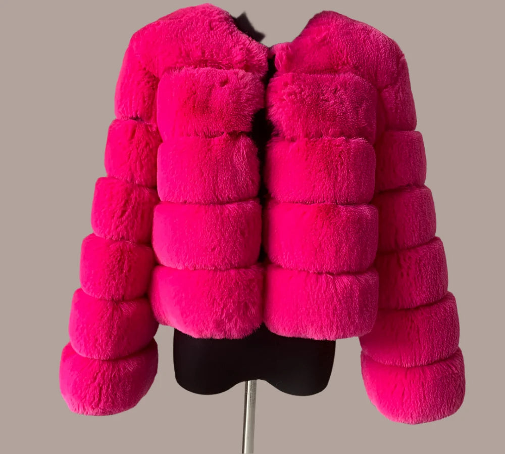"Amoura Elegance women’s short faux fur coat in soft pink, featuring luxurious fluffy faux fox fur, full sleeves, and a stylish 60 cm length, available up to size 7XL."