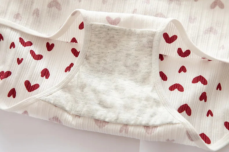Red heart-patterned panties, designed by Amoura Elegance for women’s everyday comfort.