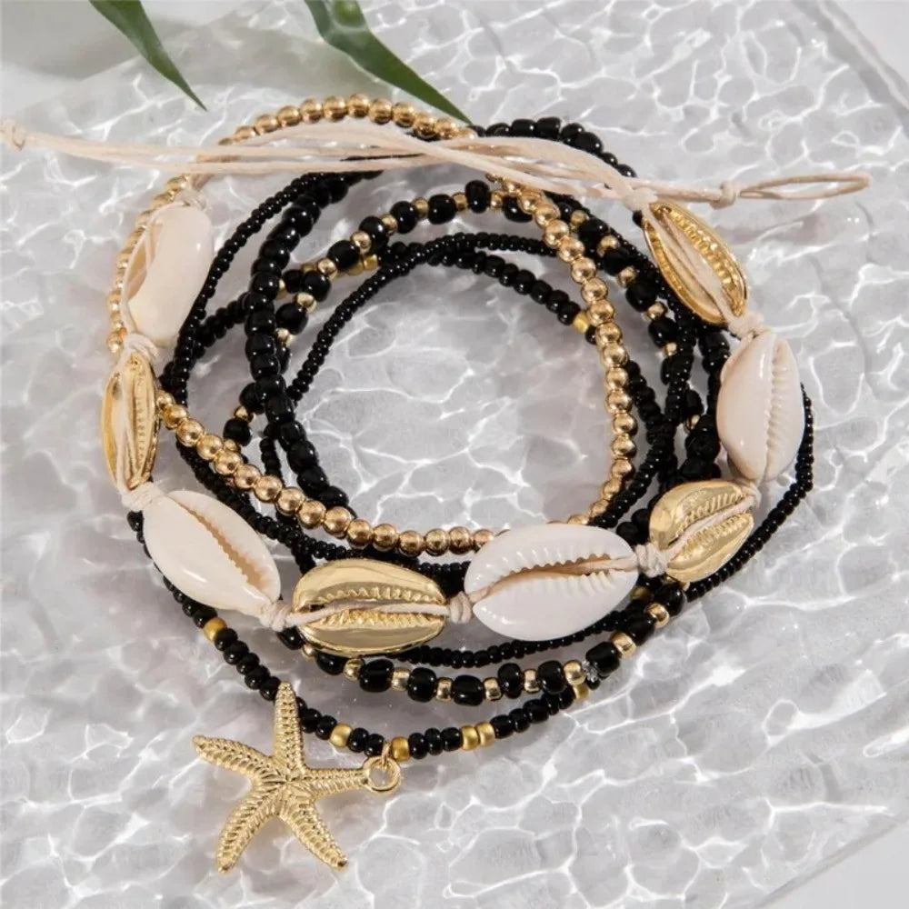 "AmouraElegance 7Pcs Bohemian Beach Rice Beads Elastic Anklet Set | Charm Alloy Anklets with Stretch Holiday Starfish & Multi-layer Design"