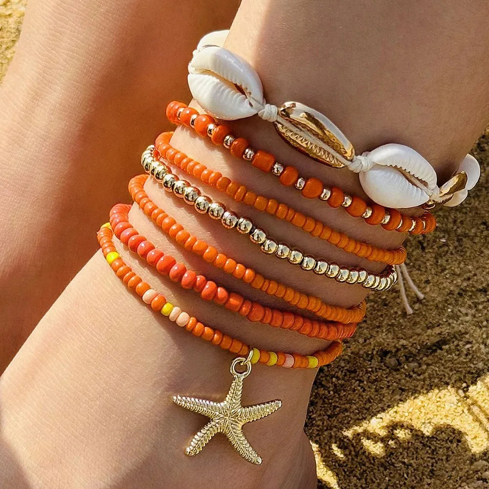 "AmouraElegance 7Pcs Bohemian Beach Rice Beads Elastic Anklet Set | Charm Alloy Anklets with Stretch Holiday Starfish & Multi-layer Design"