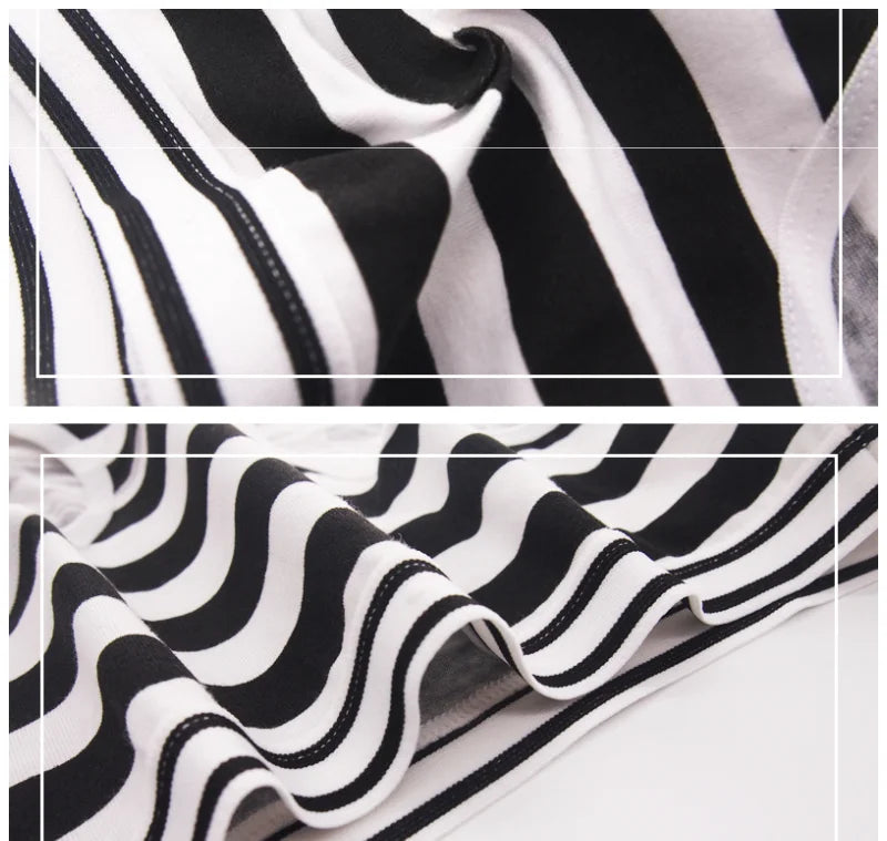 "Women's pack of 5 White and Black knickers with whimsical strips design, ideal for a soft, relaxed fit."