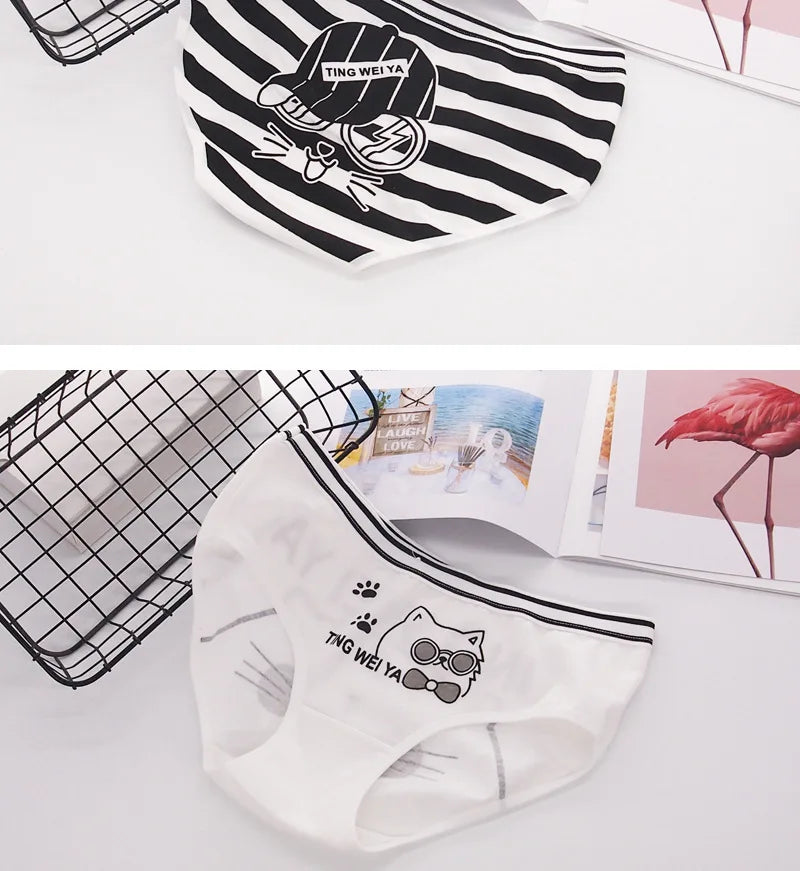"Assorted black and white color women’s briefs with cartoon cats and black strips , ideal for a playful everyday style."