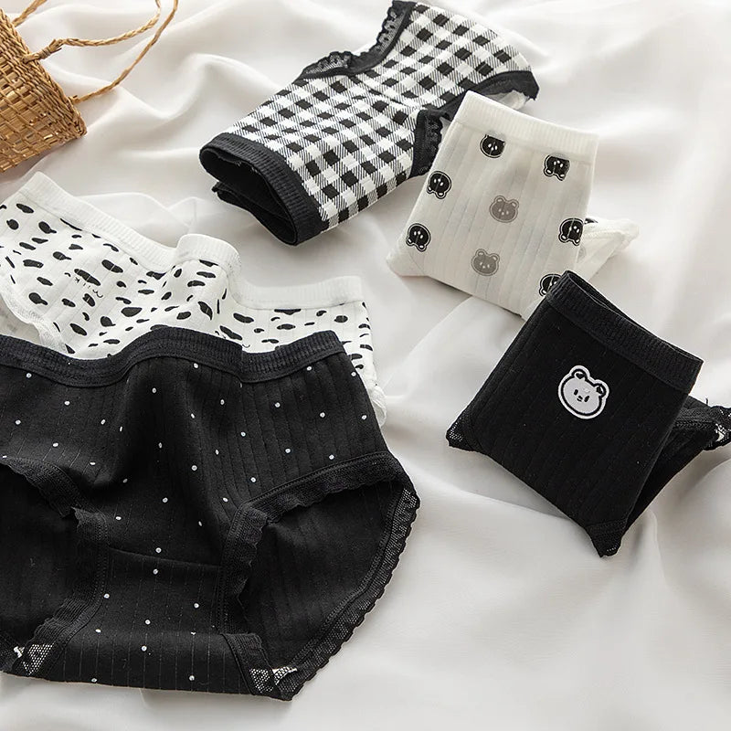 Set of black and white women’s panties with teddy prints, providing comfort and style from Amoura Elegance.