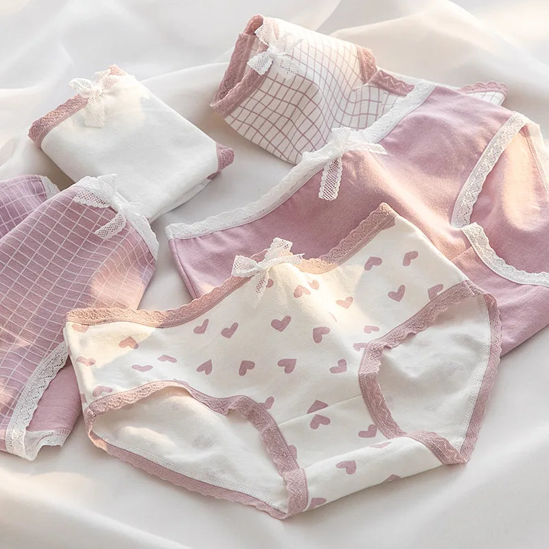 Set of soft pink and white ladies' panties with charming prints, crafted by Amoura Elegance for a comfortable and stylish everyday wear.